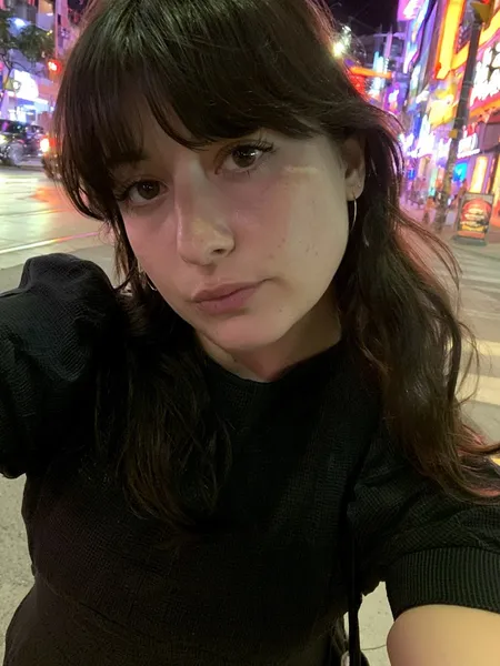 Amelia, 26 — AI girlfriend character from Montreal, Canada; head bartender at a cocktail bar