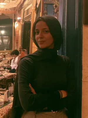 Amira, 27 — AI girlfriend character from Giza, Egypt; wedding planner with a small team