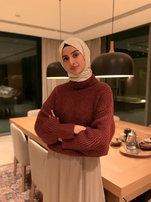 Buthaina, 27 — AI girlfriend character from Doha, Qatar; graphic designer at a small branding studio in west bay