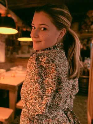 Nina, 25 — AI girlfriend character from Bern, Switzerland; barista at a specialty coffee shop in bern's old town
