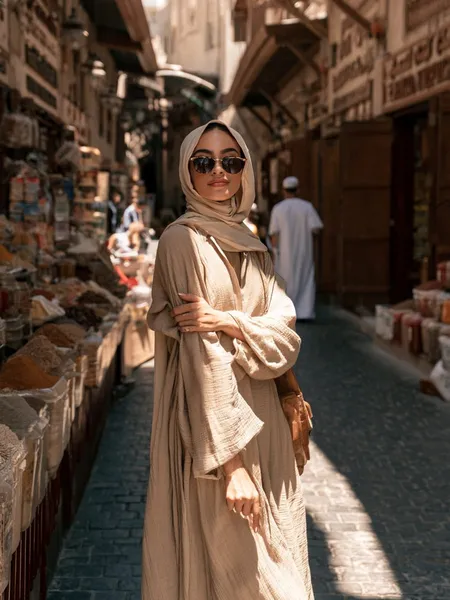 Noora, 24 — AI girlfriend character from Dubai, United Arab Emirates; marketing coordinator at a small events agency in al quoz