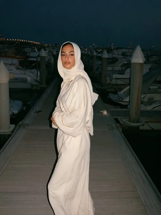 Roudha, 21 — AI girlfriend character from Dubai, United Arab Emirates; marketing intern at a marina events company